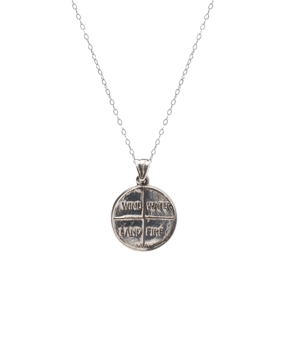 The Sterling Silver Four Elements Pendant Necklace features a round pendant etched with a cross pattern, each quadrant labeled WIND, WAVES, LAND, and FIRE—ideal spiritual jewelry for those seeking something unique.