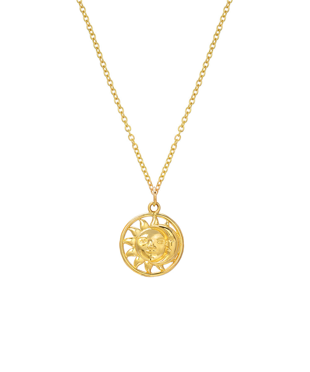 The 14 Karat Yellow Gold Sun and Moon Pendant Necklace features a detailed celestial design on a round pendant, suspended from an 18-inch gold chain. Perfectly crafted, it shines against a white background.