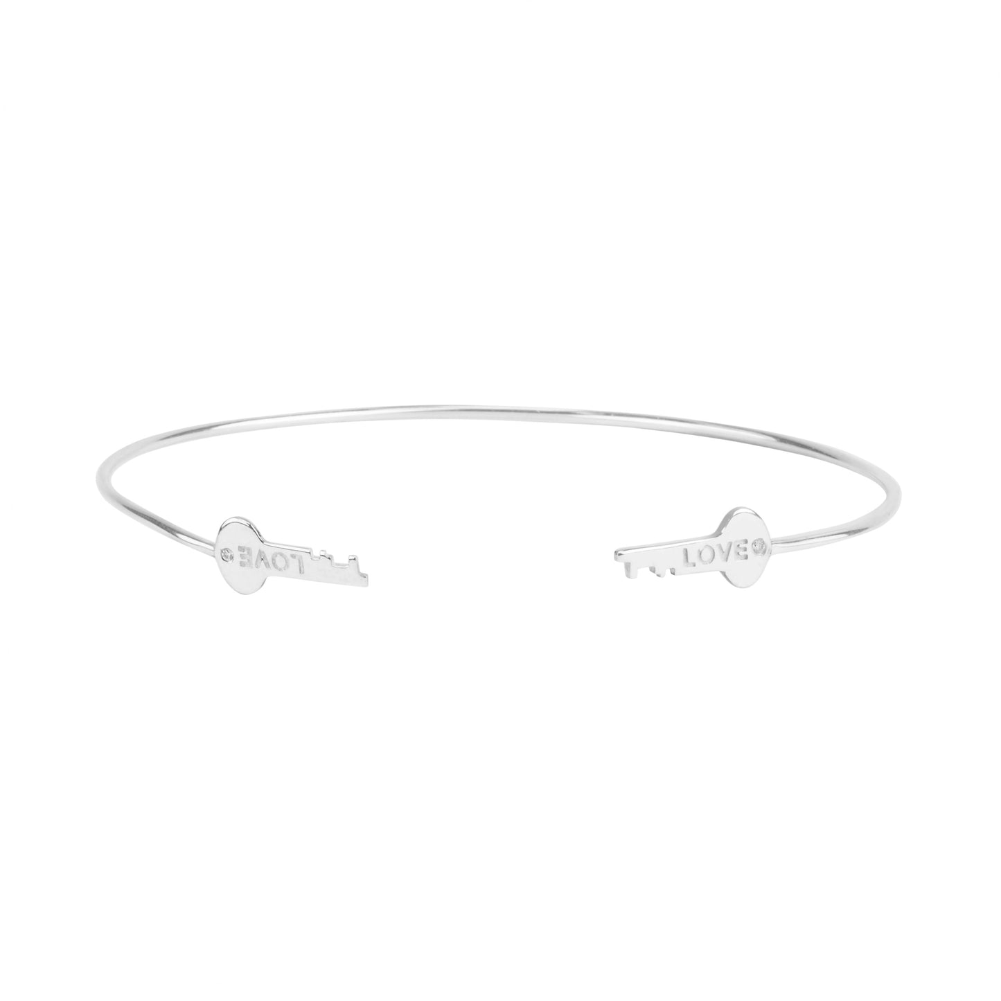 The Sterling Silver Love Key Diamond Cuff is a delicate 925 sterling silver open-ended bangle, featuring key-shaped ends—one engraved with GRACE, the other with LOVE—for a timeless and meaningful bracelet.
