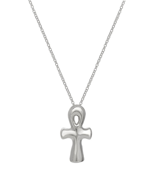 The Sterling Silver Puff Ankh Pendant Necklace features a polished, rounded pendant on a delicate chain, representing spiritual jewelry. Shown against a white background.
