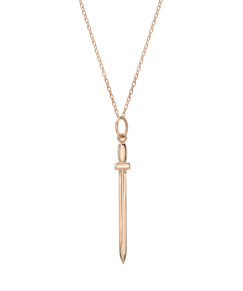 The 14KT Gold Sword of Truth Pendant Necklace features a delicate chain and a slender, vertical sword-shaped 14K gold pendant with a simple hilt design.