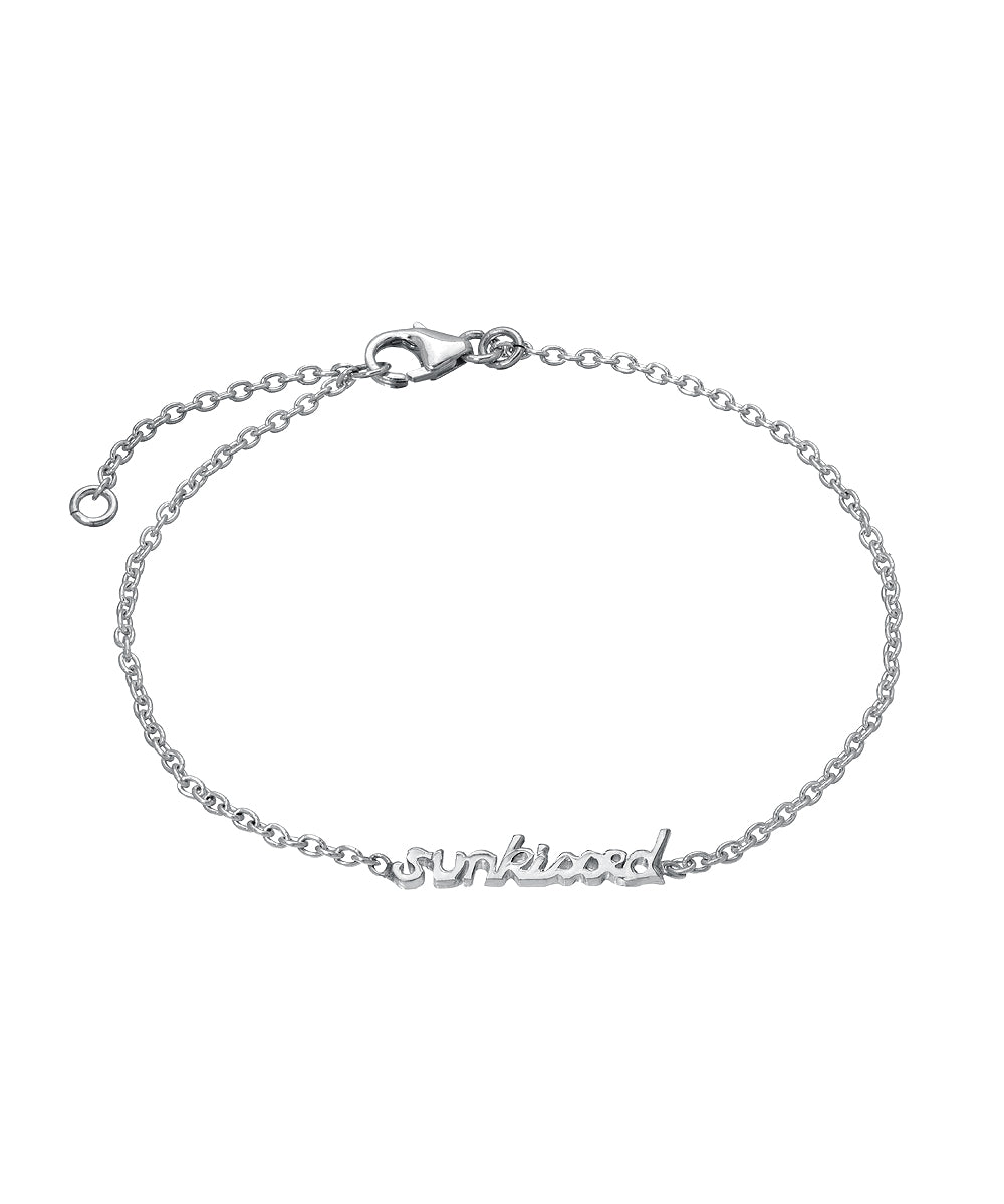 The Sterling Silver Chain Wrist and Ankle Name Bracelet is a delicate 925 sterling silver piece with a lobster clasp, featuring a center charm that spells "sunkissed" in cursive letters.