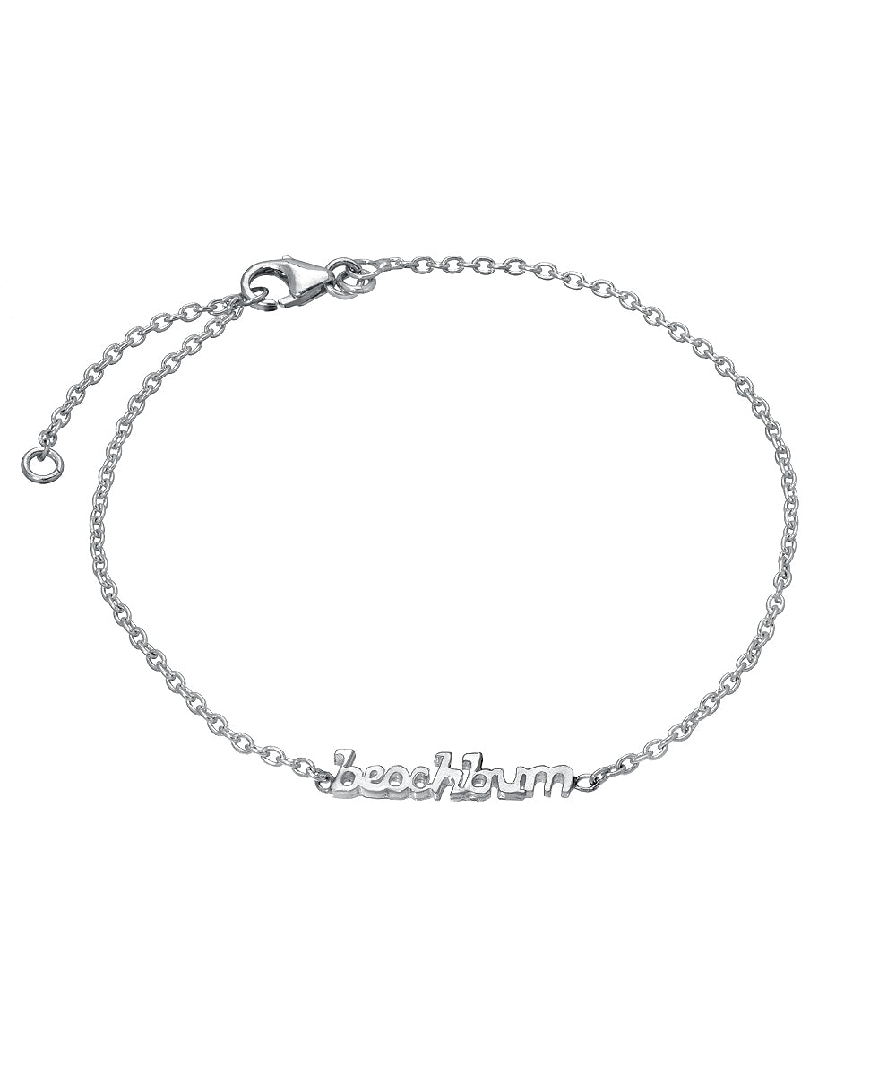 The Sterling Silver Chain Wrist and Ankle Name Bracelet features a delicate 925 sterling silver chain, lobster clasp, and a central "beachbum" charm in lowercase letters.