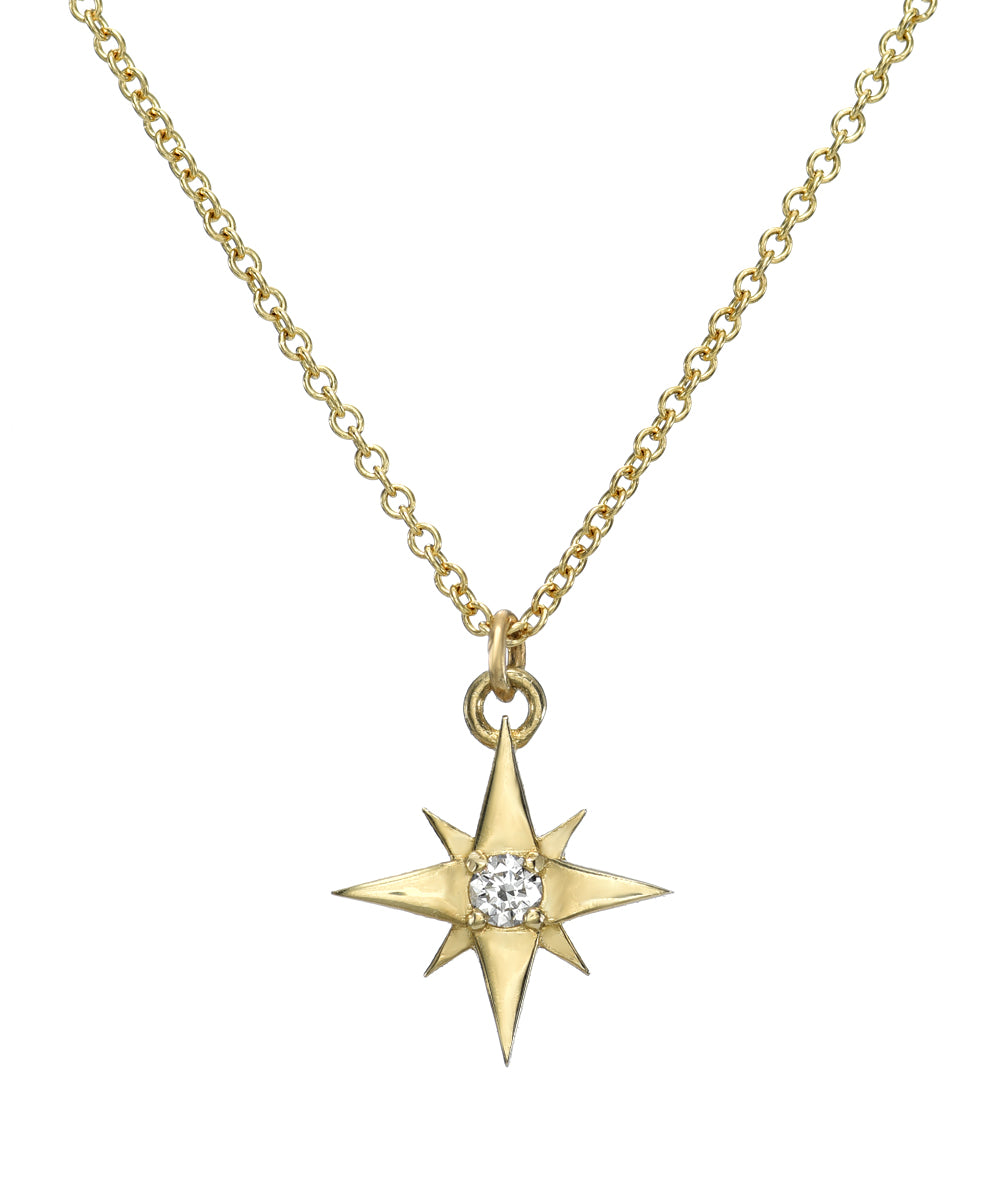 The 14K Gold Lucky North Star Diamond Pendant Necklace features a gold chain and an eight-pointed star pendant with a round diamond at the center, capturing the elegance of celestial-inspired jewelry.