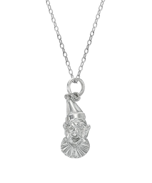 The Sterling Silver Clown Face Circus Pendant Necklace, 18", showcases a whimsical clown head with a pointed hat and ruffled collar, elegantly suspended from a delicate chain against a white background.