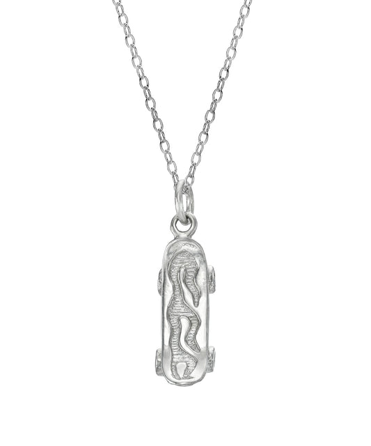 The Sterling Silver Flaming Skateboard Pendant Necklace features a mini skateboard-shaped pendant with a raised flame design on a delicate chain.