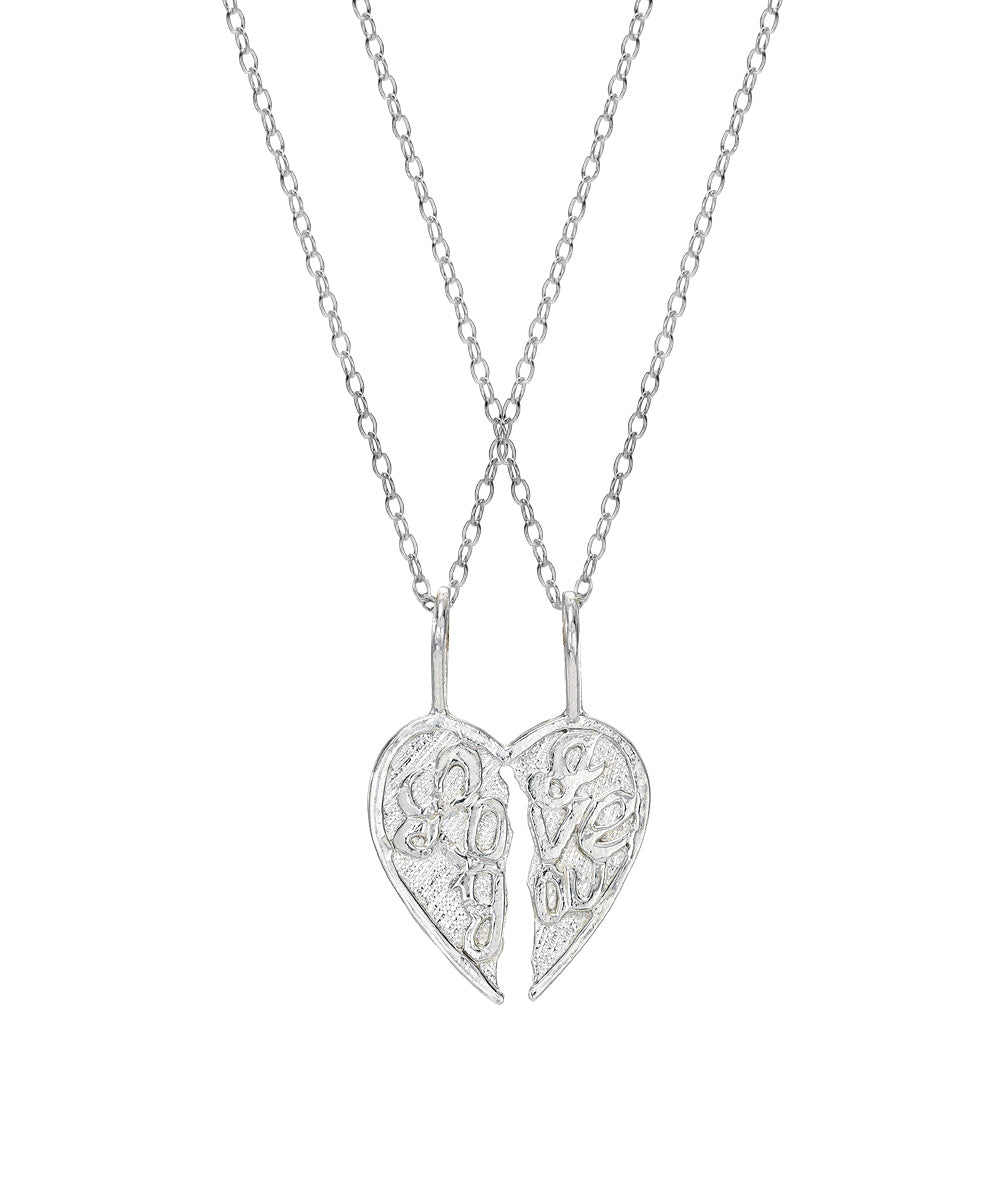 The Sterling Silver I Love You Split One Take The Other Pendant Necklace features two necklaces that join to form one heart, making it a perfect couples' gift to share your love. Each half has an intricate design.