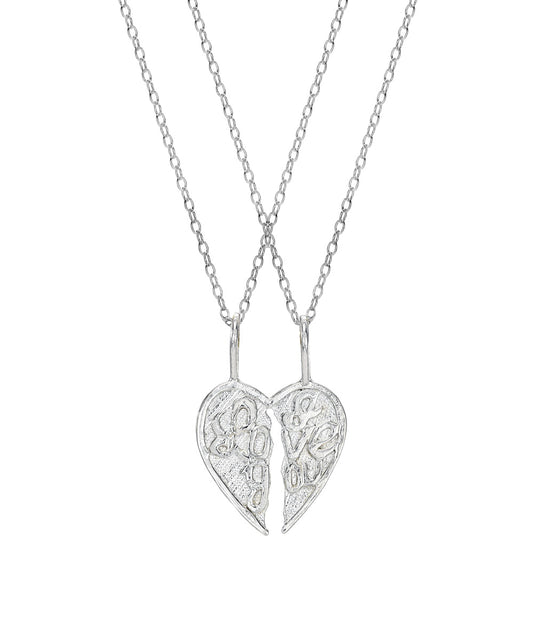 The Sterling Silver I Love You Split One Take The Other Pendant Necklace features two necklaces that join to form one heart, making it a perfect couples' gift to share your love. Each half has an intricate design.