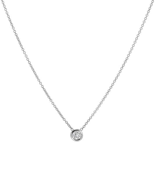 The 14KT White Gold 3 mm Bezel Solitaire Necklace features a delicate design with a single round diamond pendant set in a simple bezel at the center.