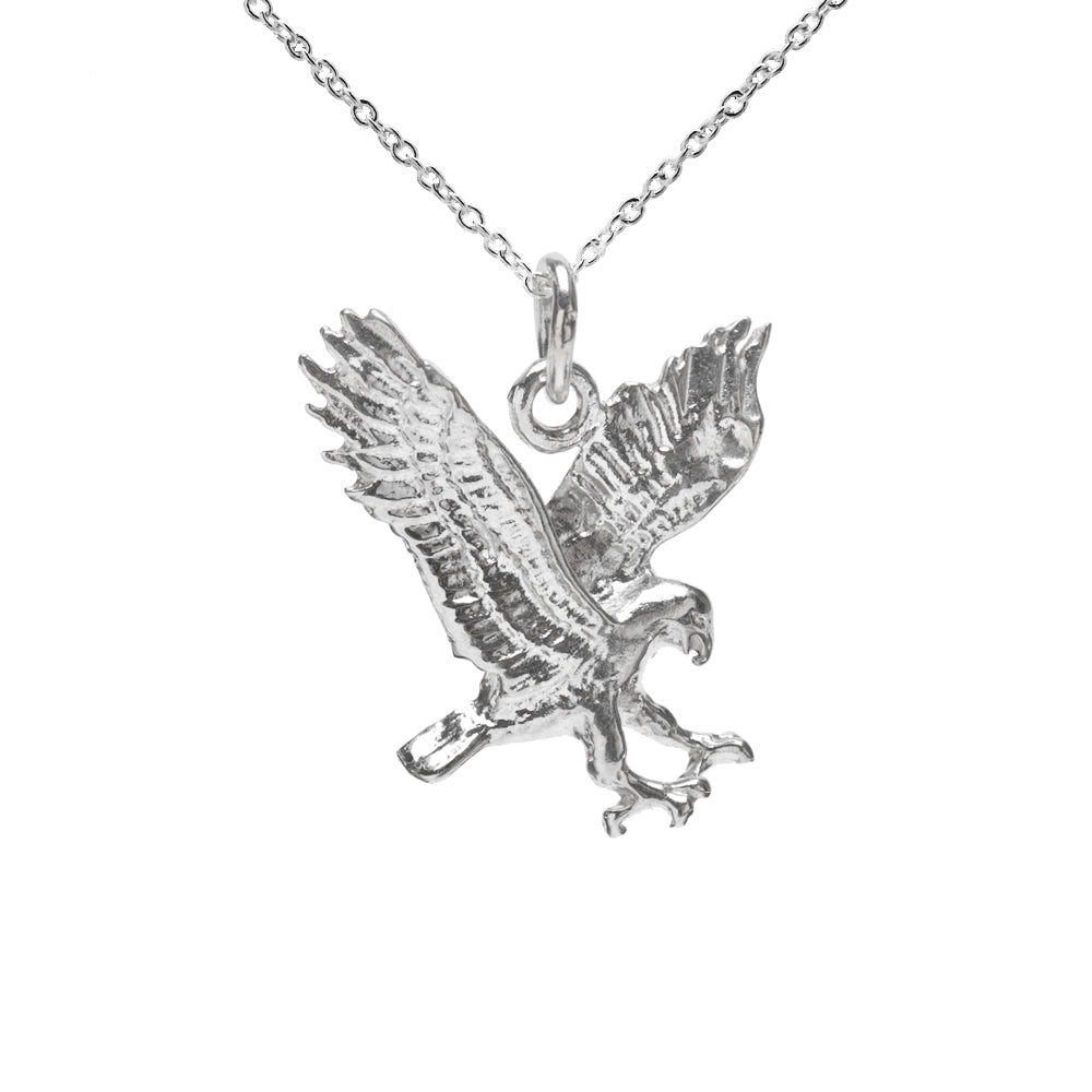 The Sterling Silver Falcon Pendant Necklace, 18", features a 925 silver falcon-shaped pendant in mid-flight with wings spread and talons outstretched, displayed against a plain white background.