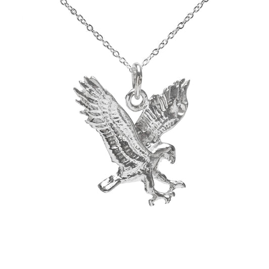The Sterling Silver Falcon Pendant Necklace, 18", features a 925 silver falcon-shaped pendant in mid-flight with wings spread and talons outstretched, displayed against a plain white background.