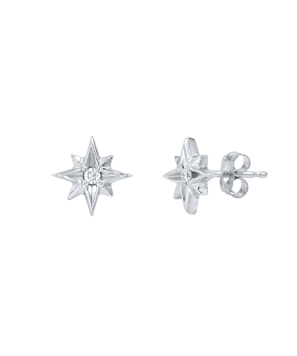 A pair of 14 Karat Gold North Star Diamond Stud Earrings (0.02 CTTW), each showcasing an eight-pointed starburst with a central diamond, is displayed on a white background.