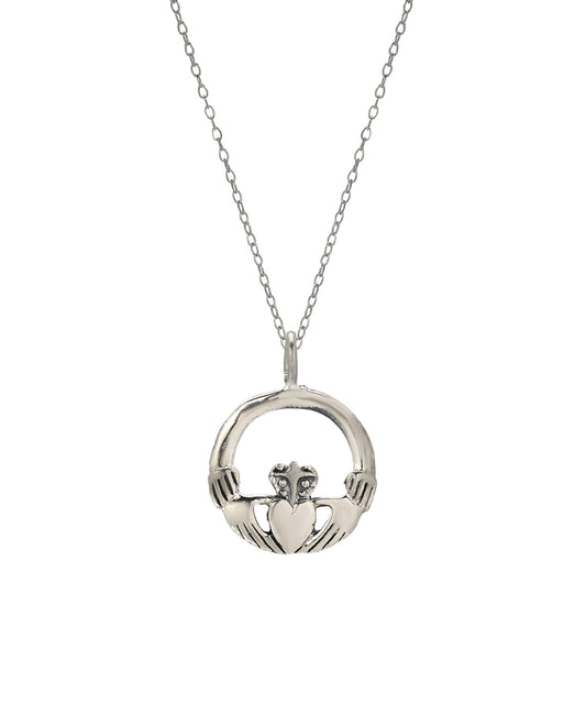 The Sterling Silver Claddagh Pendant Necklace, crafted in 925 sterling silver, features two hands holding a crowned heart and hangs from a delicate chain against a white background.