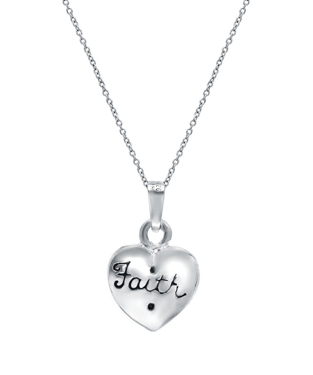 The Sterling Silver Faith And Cross On Puff Heart Reversible Pendant Necklace features a heart-shaped pendant with “Faith” and a cross, ideal for those who appreciate spiritual jewelry.