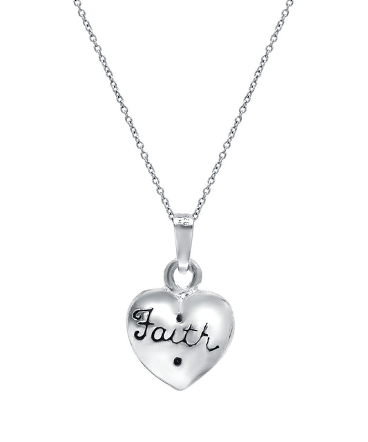 The Sterling Silver Faith And Cross On Puff Heart Reversible Pendant Necklace features a heart-shaped pendant with “Faith” and a cross, ideal for those who appreciate spiritual jewelry.