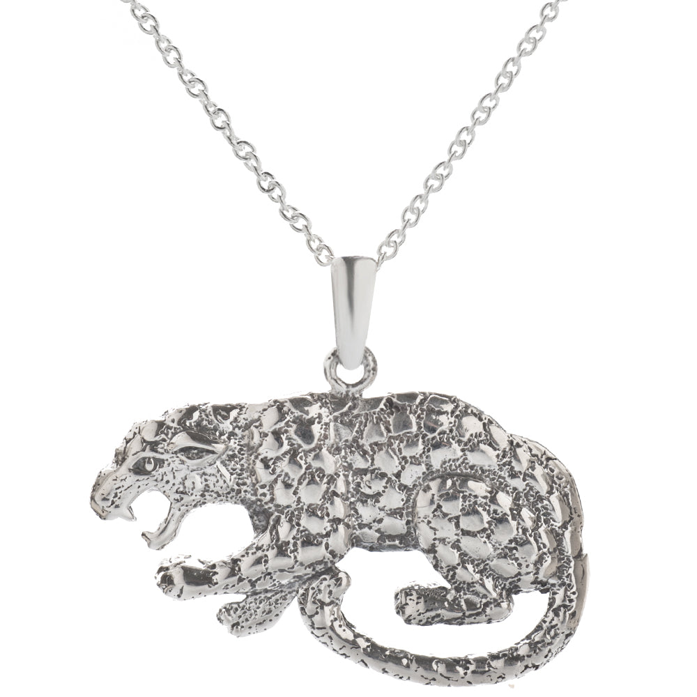The Sterling Silver Jaguar Pendant Necklace features a detailed prowling leopard pendant with spots and an open mouth, hanging from a delicate chain—a bold statement piece of animal jewelry.