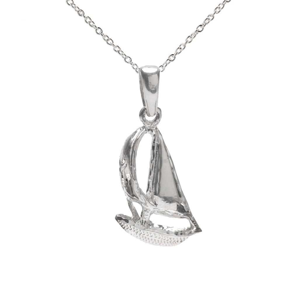 The Sterling Silver Sailboat Pendant Necklace features a detailed sailboat-shaped pendant on a fine chain, displayed against a white background—an ideal gift for nautical jewelry lovers.