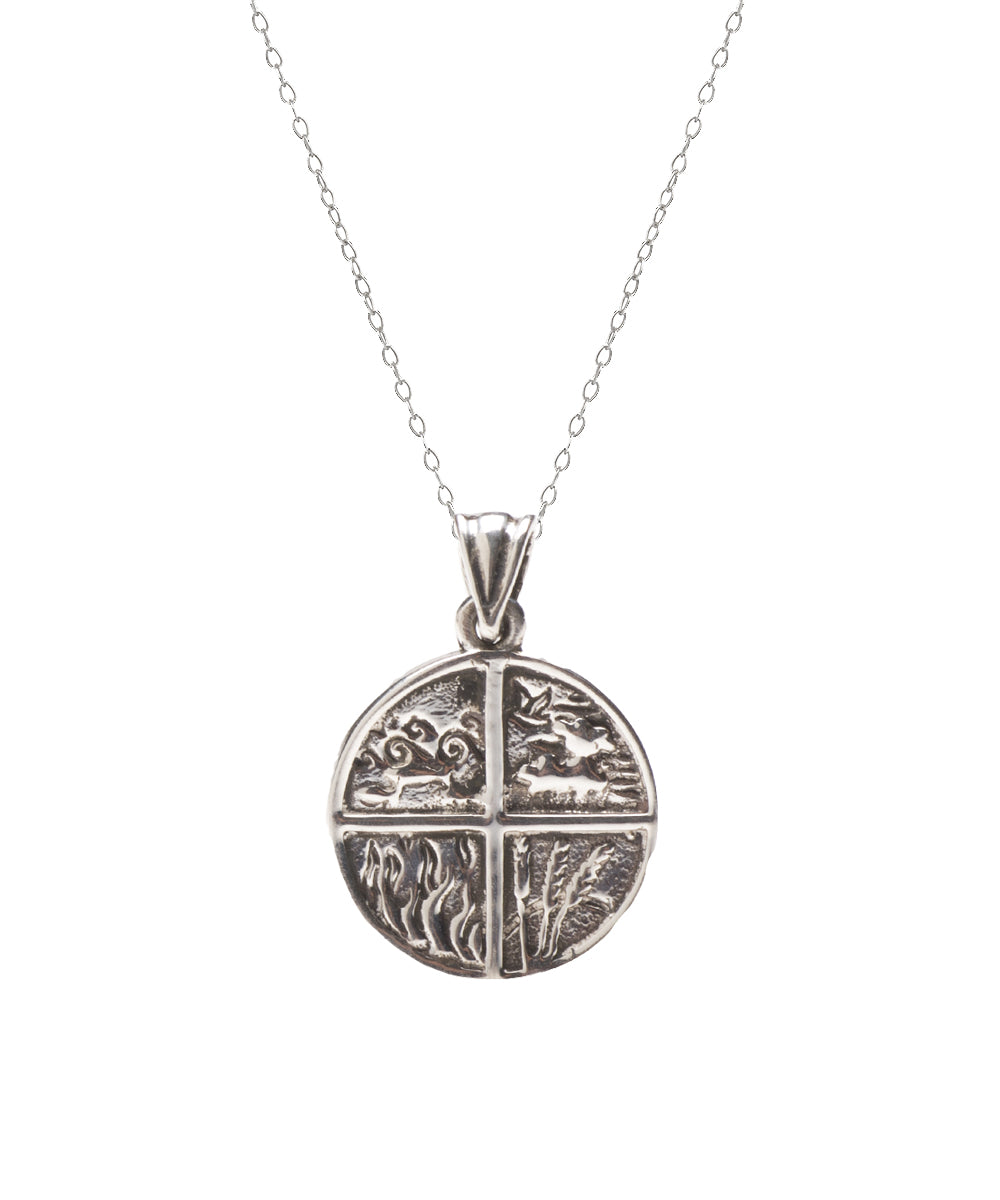The Sterling Silver Four Elements Pendant Necklace features a round pendant with four nature-inspired designs on a delicate chain—an ideal piece of spiritual jewelry for any occasion.