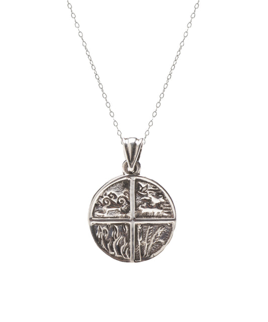 The Sterling Silver Four Elements Pendant Necklace features a round pendant with four nature-inspired designs on a delicate chain—an ideal piece of spiritual jewelry for any occasion.