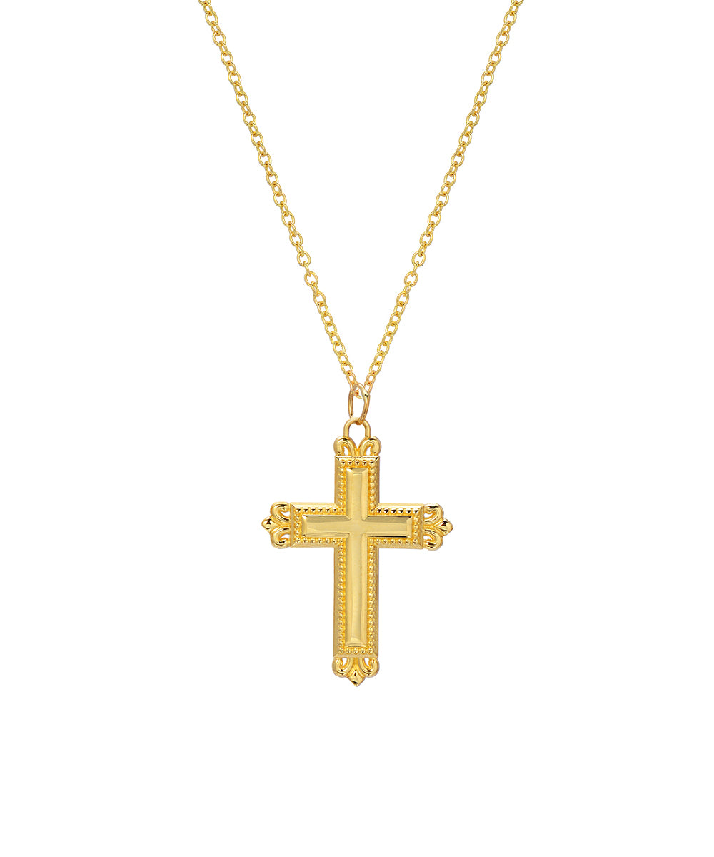 An 18" 14 Karat yellow gold Fleur cross pendant necklace showcased on an Italian rolo chain against a white background.