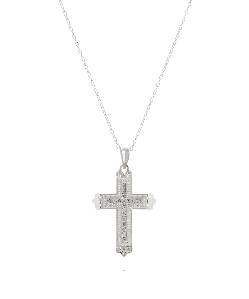 The Sterling Silver Fleur Love Cross Pendant Necklace features ornate, intricate patterns and subtle heart-shaped accents, beautifully displayed against a plain white background.