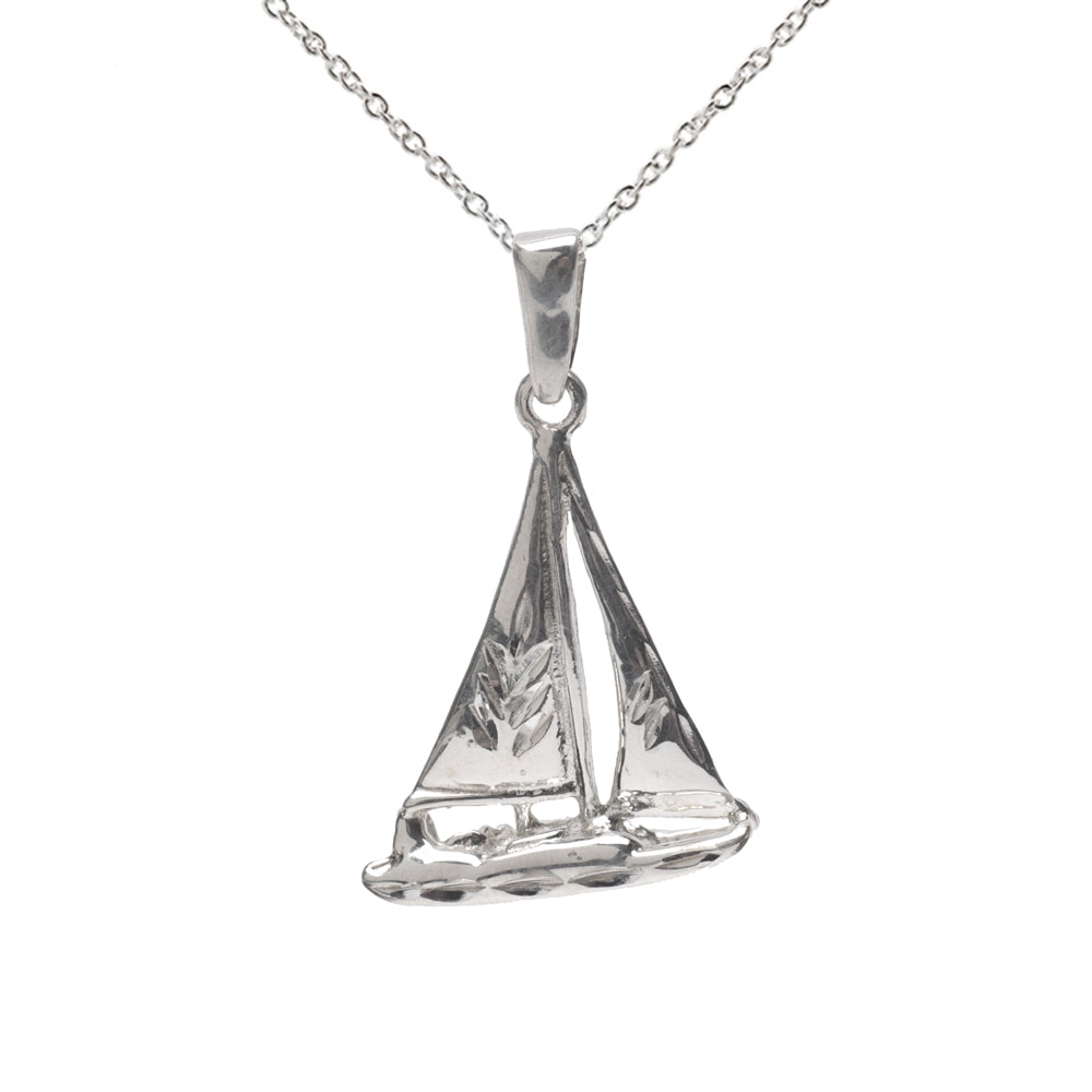 The Sterling Catamaran Sail Boat Pendant Necklace showcases a detailed sterling silver sailboat, making it an ideal gift for nautical jewelry lovers. Elegantly displayed on a white background.