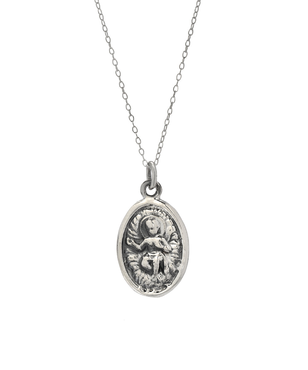 The Sterling Silver Christ Child and Protector Pendant Necklace features a delicate chain and an oval pendant with a detailed image of the Christ Child, making it a timeless piece of religious jewelry.