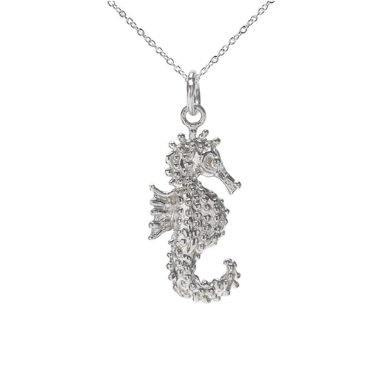 The Sterling Silver Spiked Seahorse Pendant Necklace features a textured seahorse pendant on a delicate chain, capturing nautical charm against a white background.