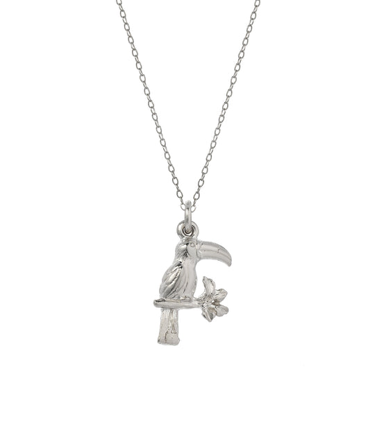 The Sterling Silver Toucan Bird Pendant Necklace features a 925 silver toucan perched on a branch with a flower, shown against a plain white background.