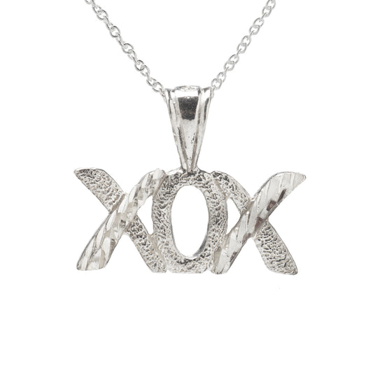 The Sterling Silver XOX Pendant Necklace features a polished, reflective "hugs and kisses" pendant on a simple 925 sterling silver chain, adding textured shine and charm to any look.