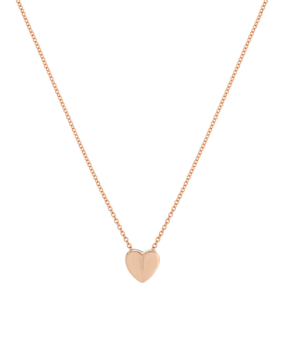 The 14 Karat Gold Sliding Heart Necklace features a polished heart pendant centered on the chain, elegantly displayed against a white background.