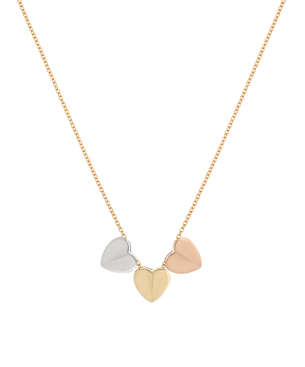 The 14 Karat Gold Sliding Heart Necklace showcases three heart-shaped pendants in silver, gold, and rose gold tones, beautifully aligned side by side at the center for an elegant and charming design.