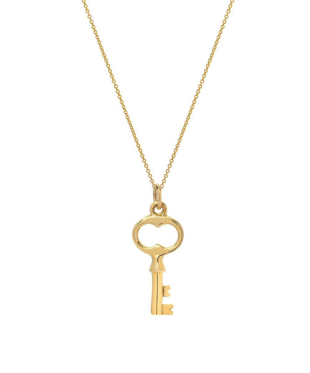 The 14 Karat Graduation Gold Key Pendant Necklace features a delicate Italian rolo chain and a vintage-inspired key pendant with a heart-shaped bow at the top.