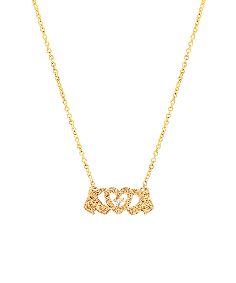 The 14 Karat Gold and Diamond Hugs and Kisses Necklace features a delicate chain with a heart-shaped pendant of intertwined hands, accented by sparkling diamonds.