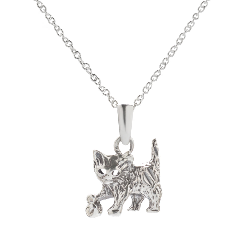 The Sterling Silver Cat Pendant Necklace features a detailed cat with a raised tail, one paw forward, and a tiny flower on a delicate chain—perfect jewelry for any cat lover.