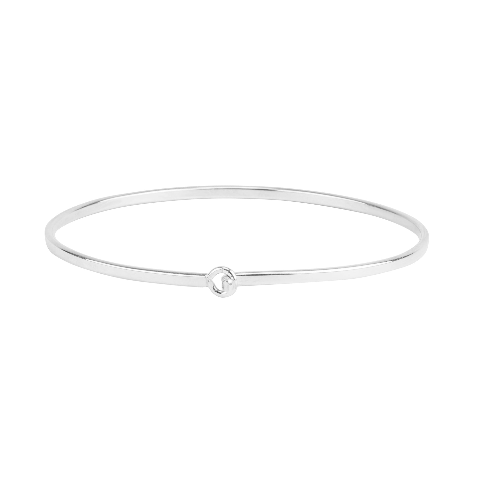 The Sterling Silver Flat Wire Latch Bracelet features a minimalist flat wire design with a subtle center knot, presented elegantly against a white background.