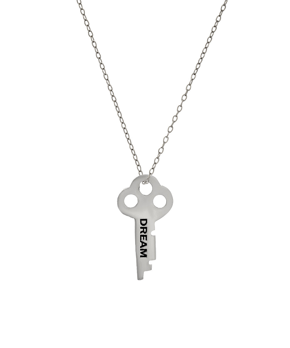 The Sterling Silver Infinite Key Pendant Necklace features an engraved "DREAM" key on a delicate chain, creating an elegant affirmation jewelry piece shown against a white background.