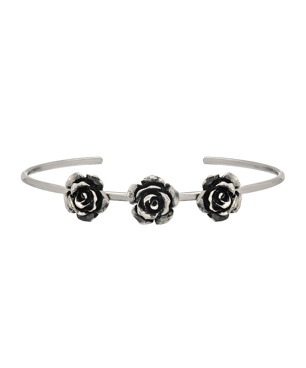 The Sterling Silver Rose Cuff features three detailed rose motifs spaced along an open band, creating an elegant floral bracelet perfect for any occasion.