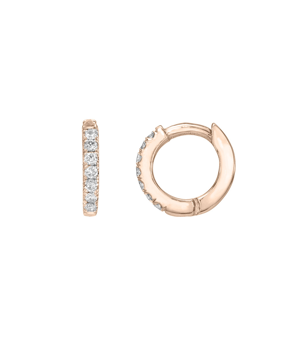 A pair of 14 Karat Yellow Gold Diamond Pave Huggie Hoops, each featuring a row of diamonds on the front. One earring is displayed from the side and the other from the front.